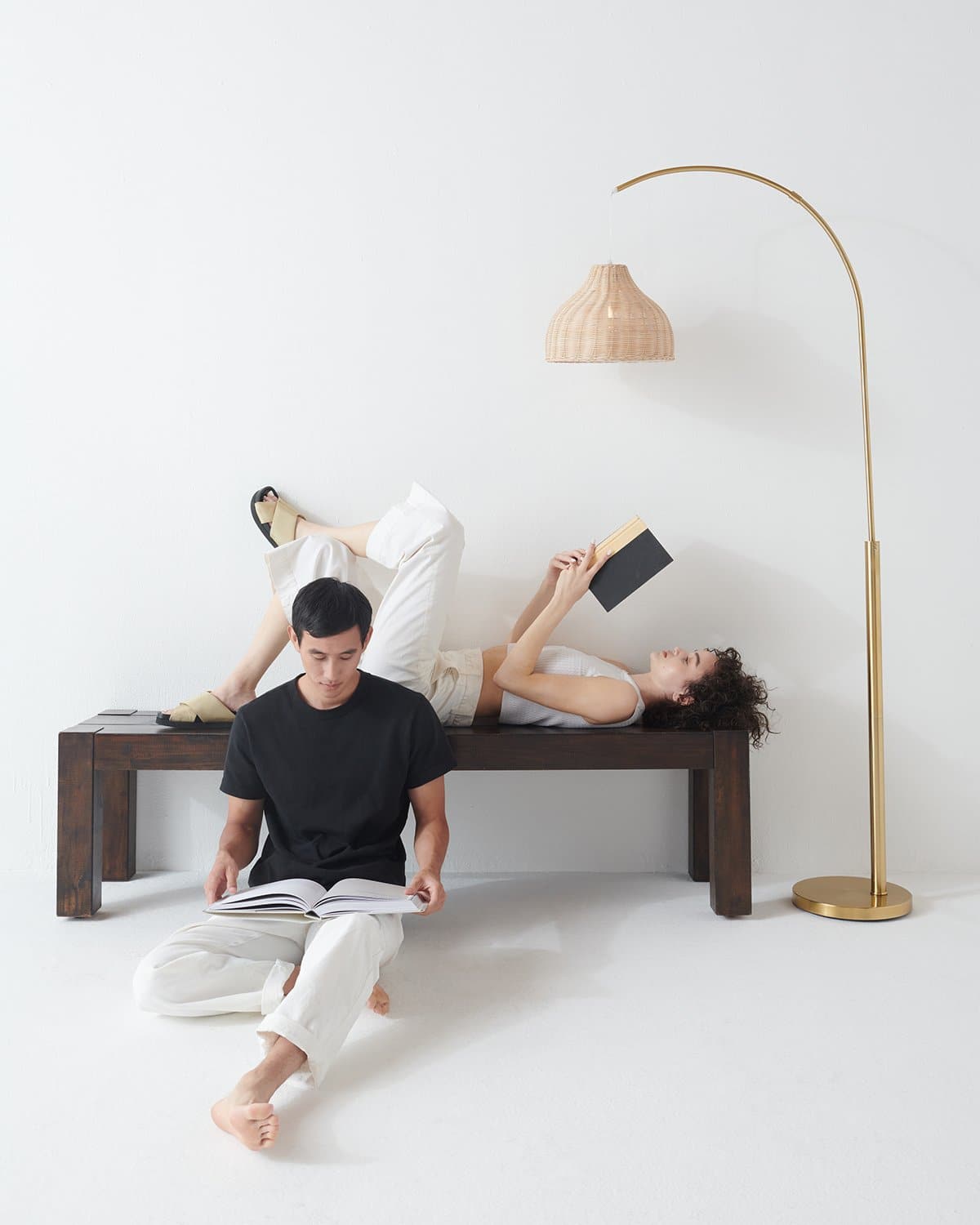 Glowmere Lark Arc Floor Lamp with Wicker Hanging Shade in brass